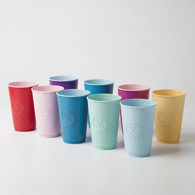 Custom branded plastic cups with a logo, arranged neatly, showing customization options