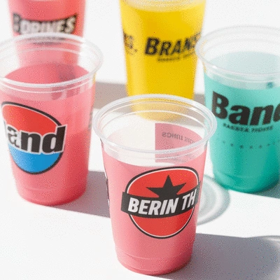 Custom plastic cups with various brand logos